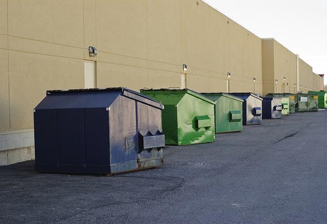 portable, green construction dumpsters serving as a container for scrap materials in Bethel